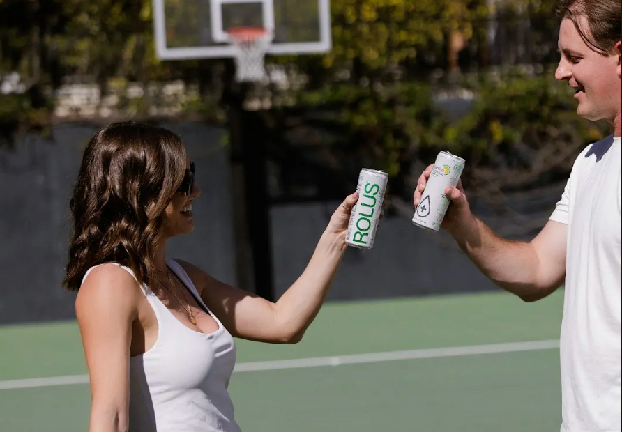 Two people sharing ROLUS, which offers non-alcoholic hydration during the summer.